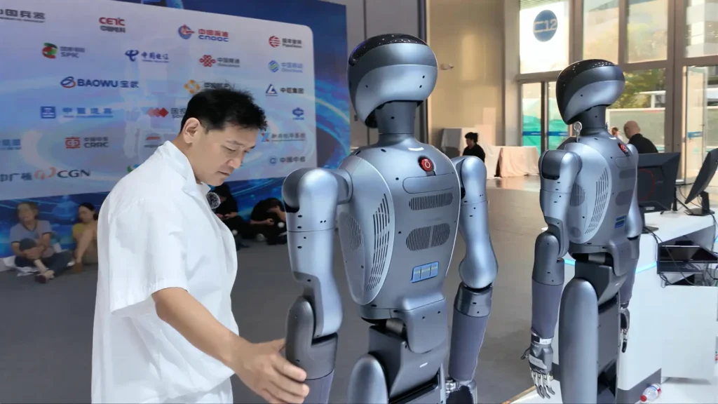 LKK Design founder Jia Wei examining humanoid robot embodied AI at WRC 2026 World Robot Conference